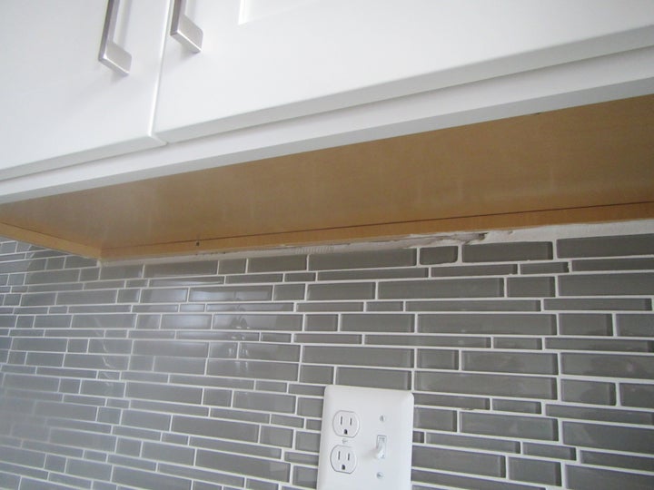 Unfinished Backsplash; Outlet should be GFI as this is next to the sink.