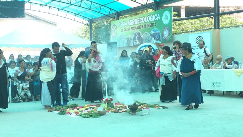 An offering to Pachamama during the inauguration of this pictured space for use in a weekly "farmer's market"