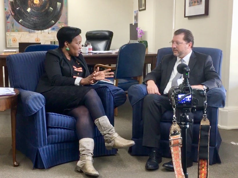 Kholi Buthelezi, National Coordinator of Sisonke Movement in South Africa and David Grosso, D.C. Councilmember At-Large, disc