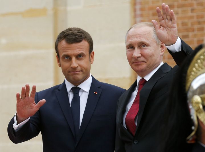 French President Emmanuel Macron, left, seen with Russian President Vladimir Putin in May, has criticized RT as a Russian propaganda outlet.