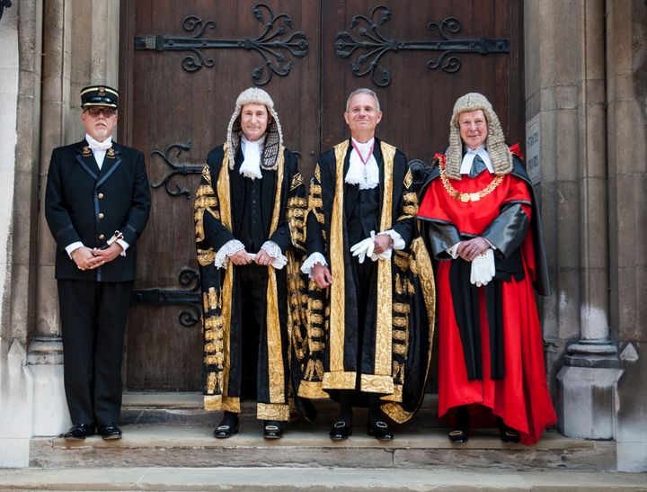 Justice Secretary David Lidington, centre, alongside Master of the Rolls Sir Terence Etherton, left, and Lord Chief Justice Lord Thomas, right