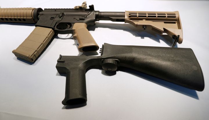 A bump stock attaches to a semi-automatic rifle to increase the firing rate.