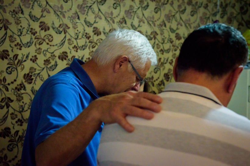 Richard Stearns and Pastor Miled pray together during a recent trip in Lebanon.