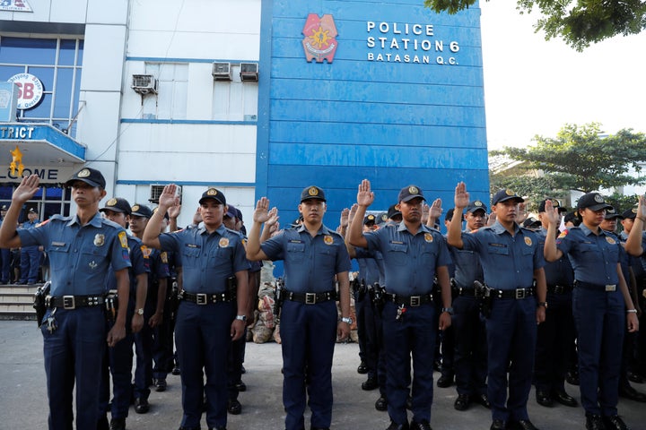 Policemen swear allegiance to the Constitution. 