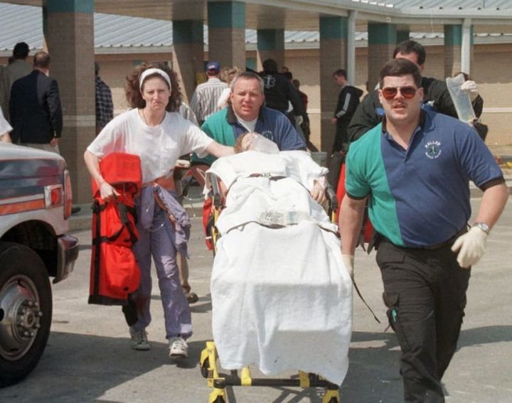 Emergency personnel rush an unidentified student to an ambulance at Westside Middle School. 