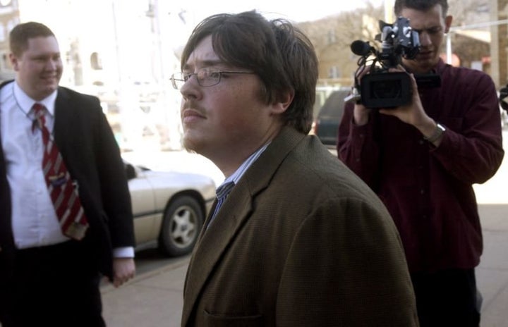 Mitchell Johnson, center, taking a break from trial in Fayetteville, Ark., Jan. 29, 2008. Johnson, then 23, faced one count of possessing of a firearm while being a user or being addicted to a controlled substance.