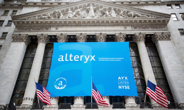 Alteryx signage is displayed in front of the New York Stock Exchange during the company's initial public offering, March 24, 2017. The company left personal information describing 123 million U.S. households exposed.