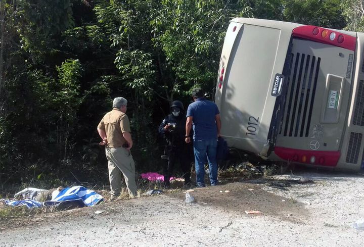 Mexican police officers and paramedics responded to the scene of the bus crash that left at least 12 people dead.