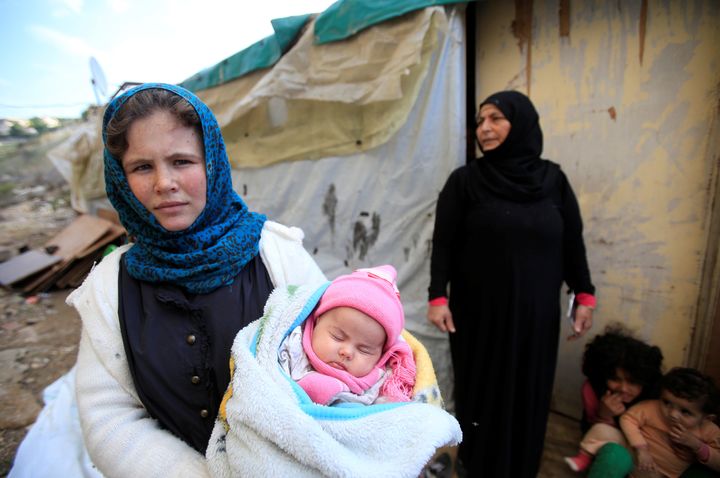 A Syrian refugee with her family in Lebanon 