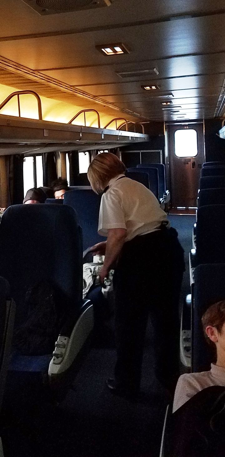 <p>Coach Attendant Mary Hooper continues with her duties Monday on Amtrak’s Empire Builder.</p>