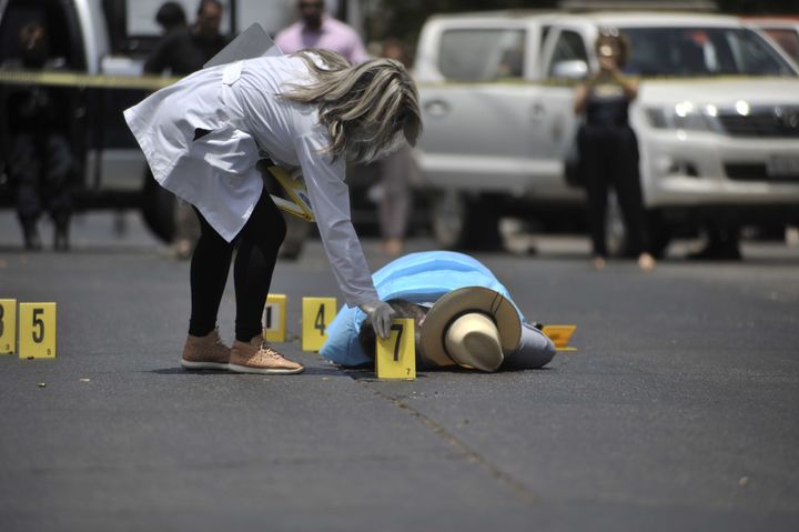 The body of Mexican journalist Javier Valdez lies on the street after he was shot dead in May.