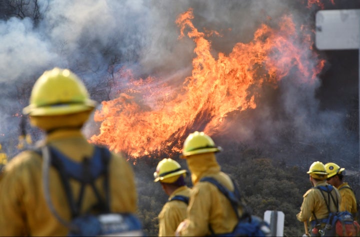 Firefighters attack the Thomas fire's north flank with backfires near Ojai, Dec. 9, 2017.