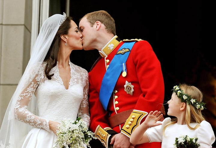 Prince William kisses his bride on the balcony of Buckingham Palace.