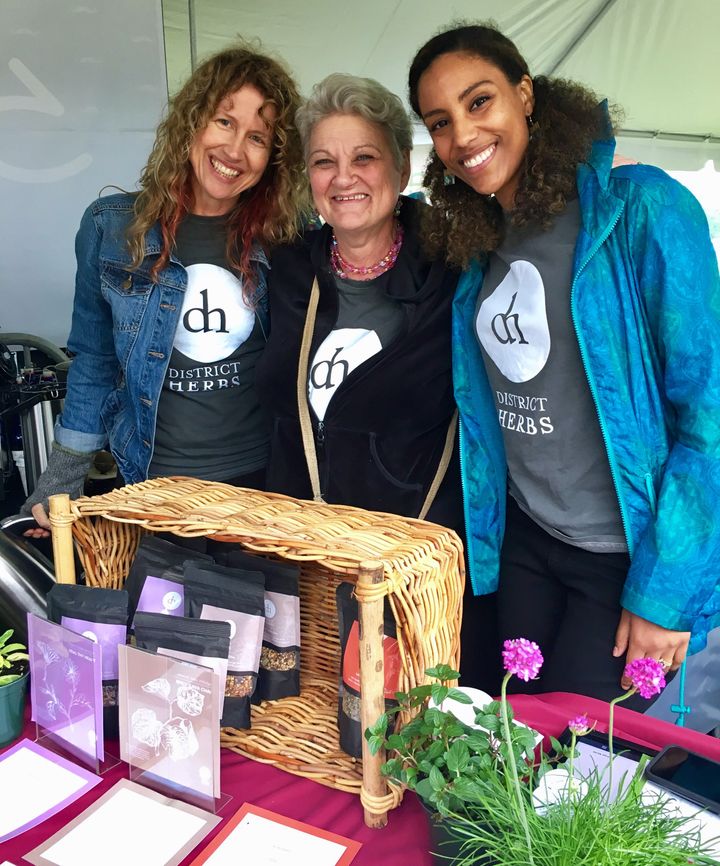 <p>District Herbs at the National Cannabis Festival in 2017. Right to Left: Colleen Zuntag, Claudia Joy Wingo, and Ebony Payne.</p>
