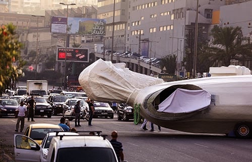 Statue of Saint Charbel transported to the town of Faraya (courtesy AFP)