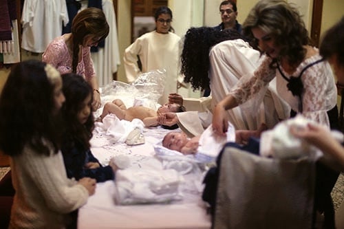 Mothers prepare their babies during a baptism at a Maronite church in Beirut (courtesy Patrick Baz)