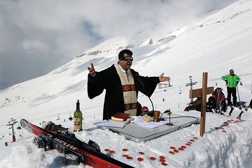 Maronite Father Hani Taouk leads a mass on the ski slopes of the Cedars Mountains (courtesy AFP)