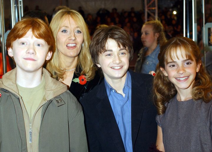 Rupert Grint, Daniel Radcliffe, and Emma Watson with the author J K Rowling.