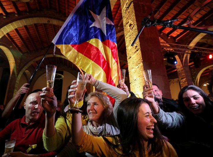 People react as results come in at a gathering of the Catalan National Assembly in Barcelona