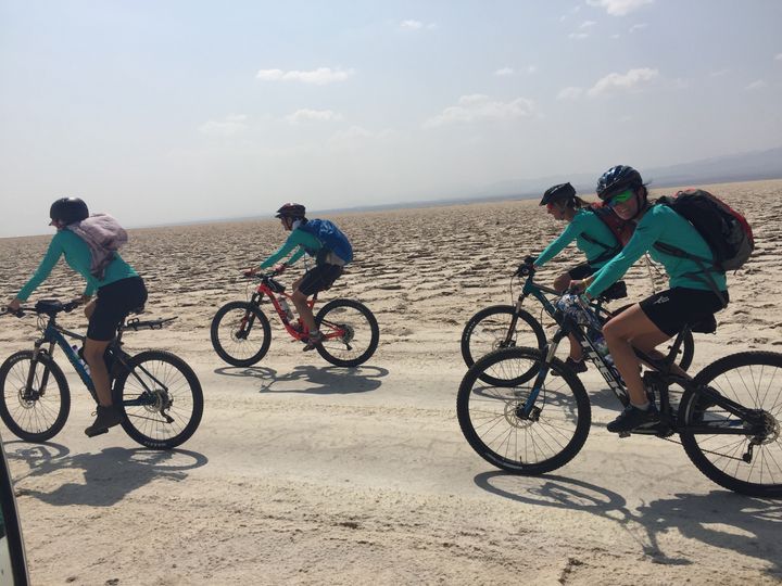 <p>The team cycling across the salt plains on the way to Dallol </p>
