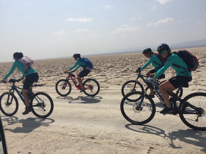 <p>The team cycling across the salt plains on the way to Dallol </p>
