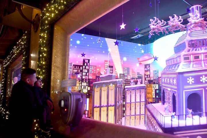 <p><em>A father and child enjoying the holiday windows at Macy’s.</em></p>