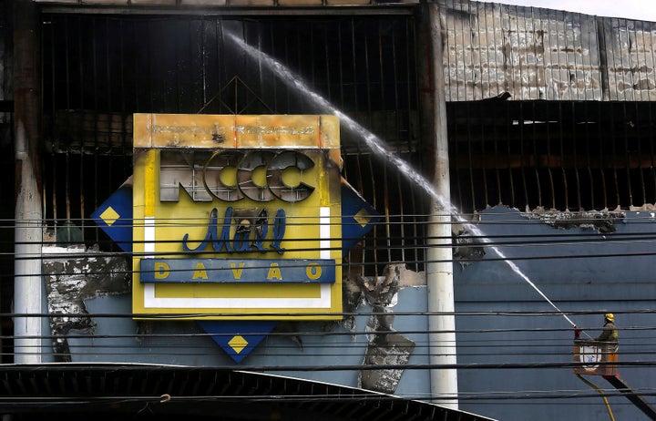 On Sunday, a day after the blaze began, firefighters were still unable to enter the still-smouldering building.