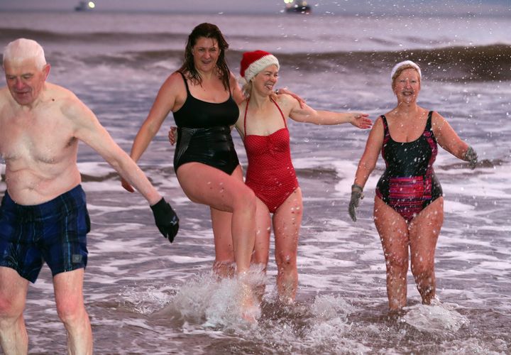 Swimmers take the plunge at King Edward’s Bay, Newcastle, on Christmas Day