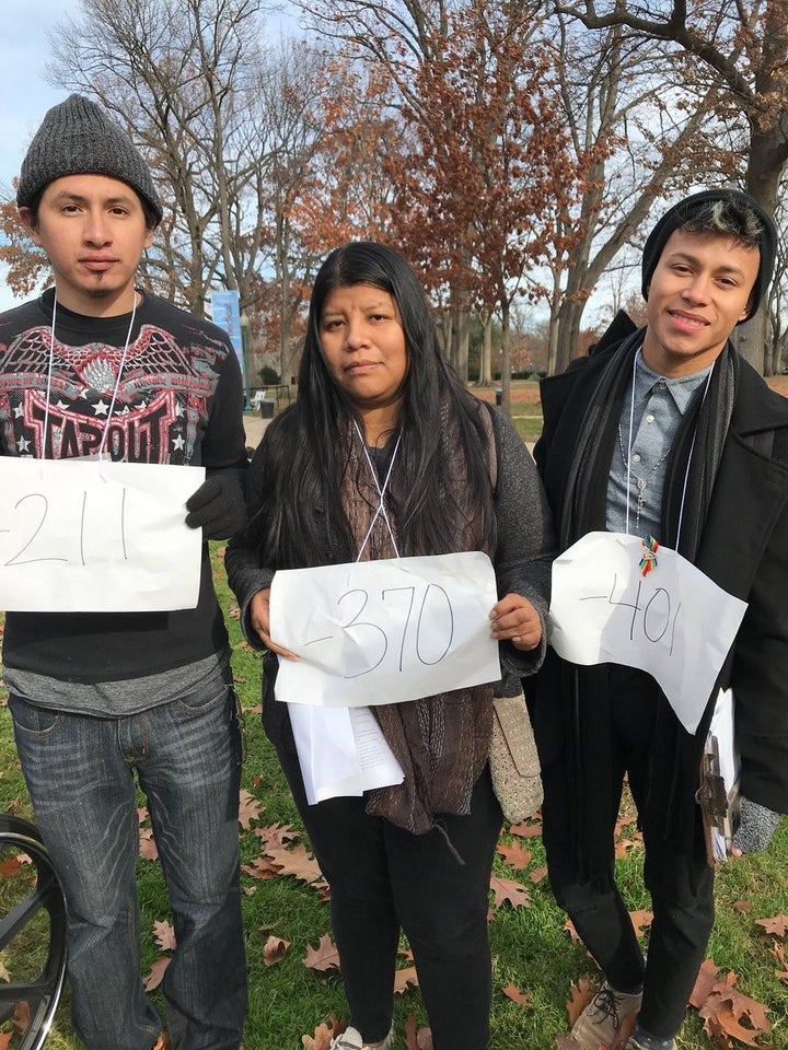 Dreamers hold up signs showing how many days they have left in the U.S. before their DACA expires.