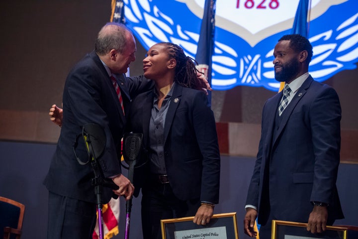 House Majority Whip Steve Scalise hugs Capitol Police Special Agent Crystal Griner as fellow Special Agency David Bailey look