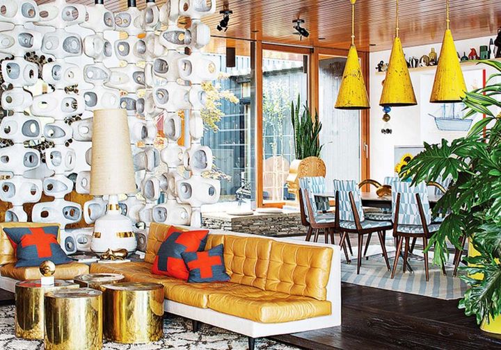Above, the dining area of Jonathan Adler and Simon Doonan’s Shelter Island home (as featured in Dwell) goes maximalist with its eclectic combination of color, shape, and juxtaposition of vintage and modern décor.