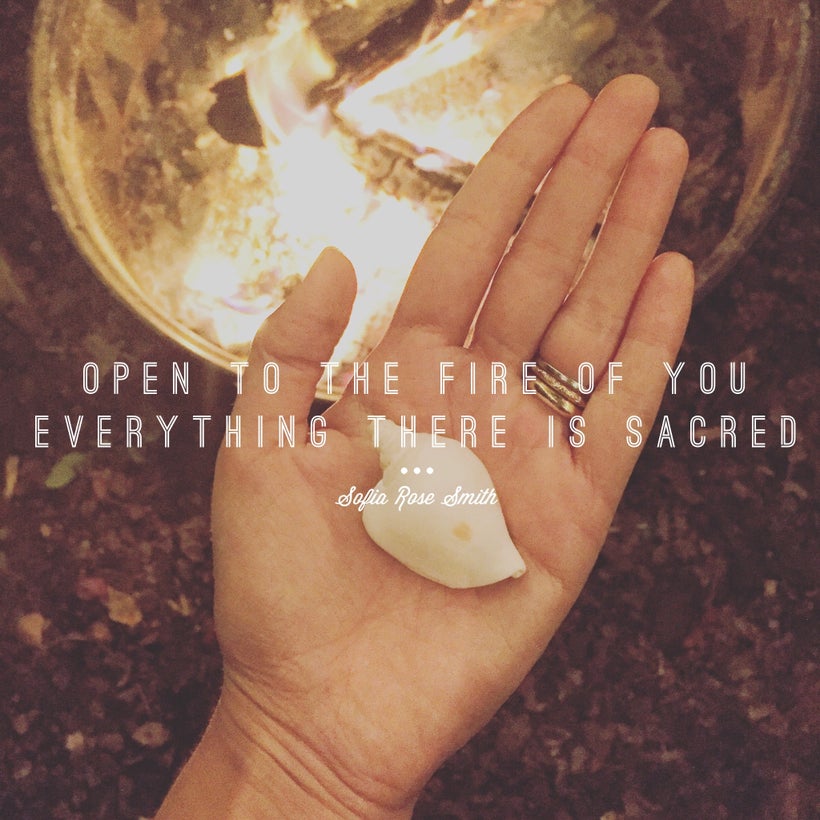 Sofia’s hand hovers over an open fire. Inside her palm is a white shell. Text reads: “open to the fire of you / everythi