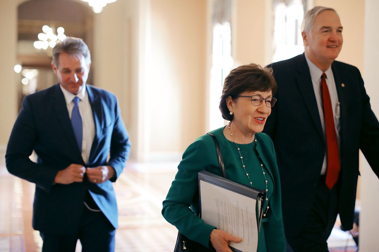 Sen. Jeff Flake (R-Ariz.), left, and Sen. Susan Collins (R-Maine), center, did not change their votes after meeting with Barkan. But he forced them to view his frailty before voting "yes."