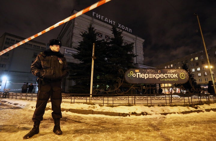 ST PETERSBURG, RUSSIA - DECEMBER 27, 2017: A police officer seen by the Perekrestok supermarket in Kalinina Square. An explosion inside the store has injured several people.