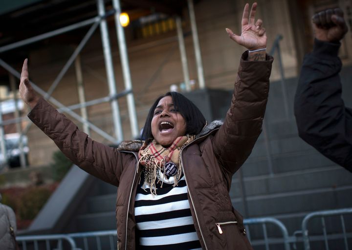 Erica Garner, the daughter of Eric Garner, leads a chant at a protest and candlelight vigil in the Staten Island borough of New York City on Jan. 15, 2015.