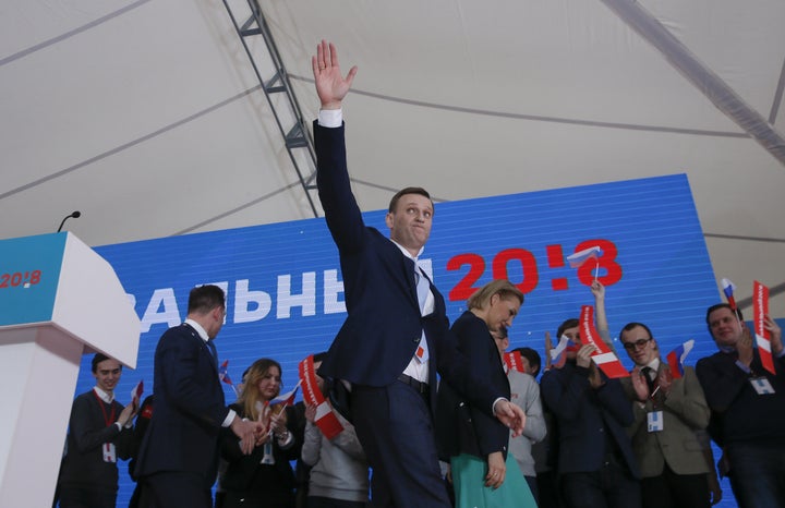 Russian opposition leader Alexei Navalny and his wife, Yulia, attend a rally in Moscow calling for the upholding of his presidential bid, Dec. 24, 2017.