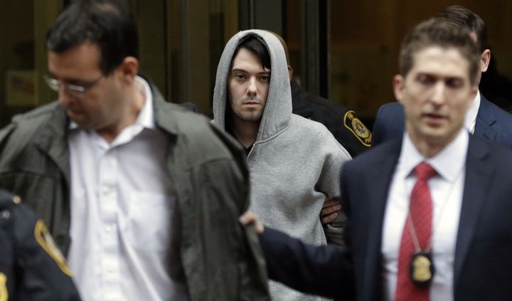 Martin Shkreli, center, and his attorney Evan Greebel, left, faced charges related to Shkreli’s management of his previous drug company, Retrophin, and of two hedge funds.
