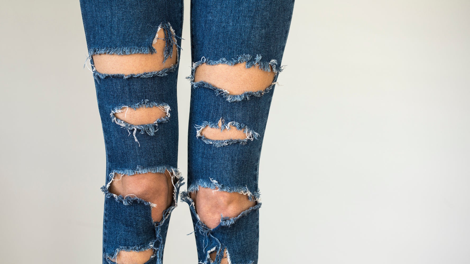 Ripped jeans with hot sale holes