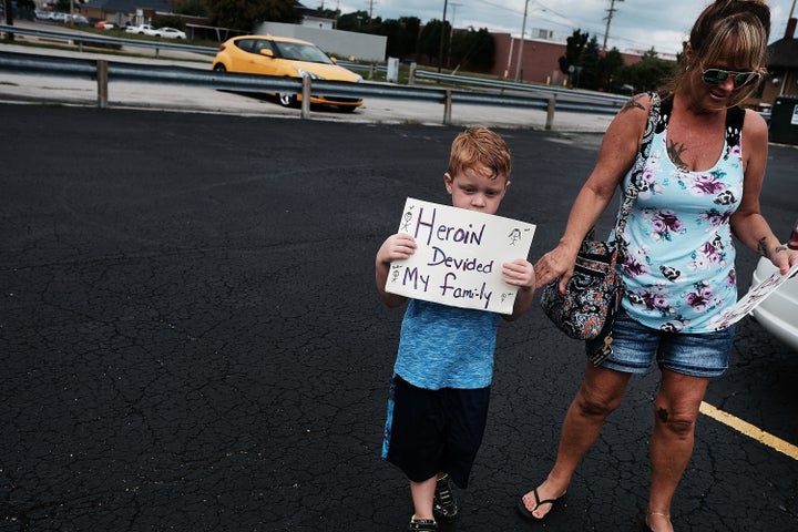 A boy attends a march through the streets of Norwalk agains the epidemic of heroin.