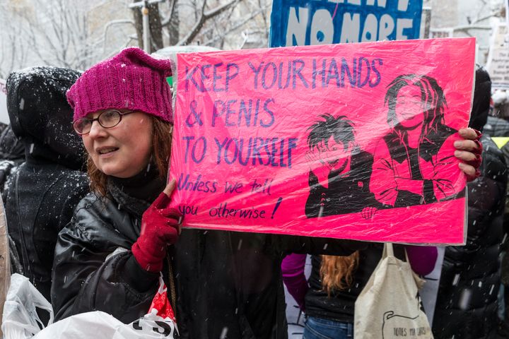 A #MeToo rally drew dozens of protesters to the Trump International Hotel at New York's Columbus Circle on Dec. 9.