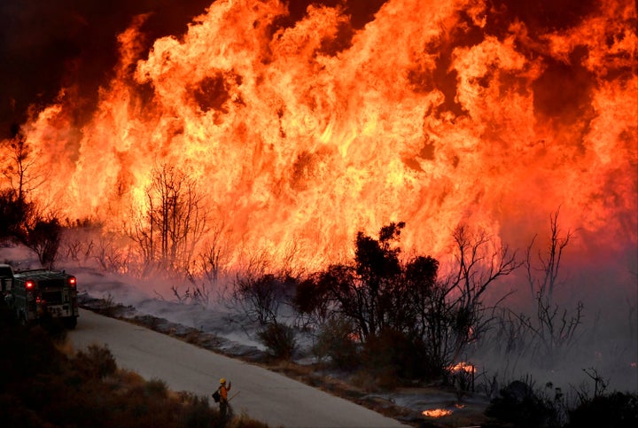 Firefighters battle the massive Thomas fire near Ojai, California, on Dec. 9.