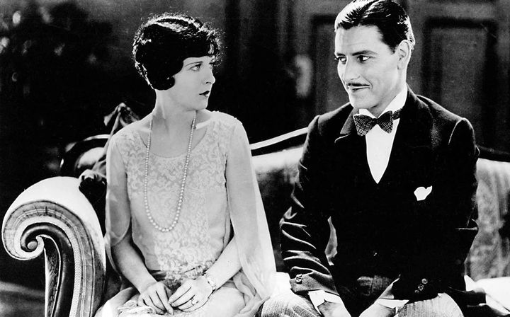 Mary McAvoy (Lady Windermere) and Ronald Colman (Lord Darlington) in a scene from the 1925 silent film, Lady Windermere's Fan 