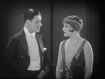 Ronald Colman (Lord Darlington) and Irene Rich (Mrs. Erlynne) in a scene from 1925's silent adaptation of Lady Windermere's Fan 