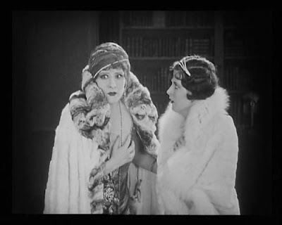 Irene Rich (Mrs. Erlynne) and Mary McAvoy (Lady Windermere) in a scene from the 1925 silent film, Lady Windermere's Fan 