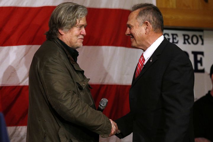 Republican candidate for U.S. Senate Judge Roy Moore and former White House chief strategist Steve Bannon shake hands during a campaign event in Fairhope, Alabama on Dec. 5, 2017