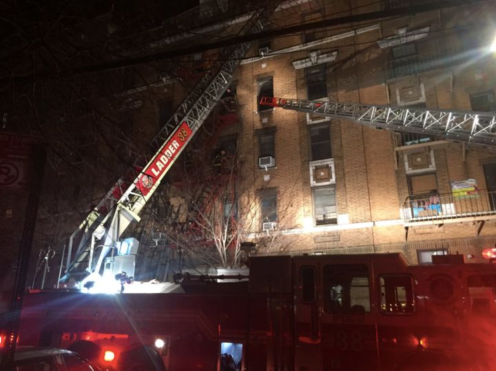 Firefighters responded to a massive blaze at a Bronx apartment building in which at least 12 people had died late Thursday.