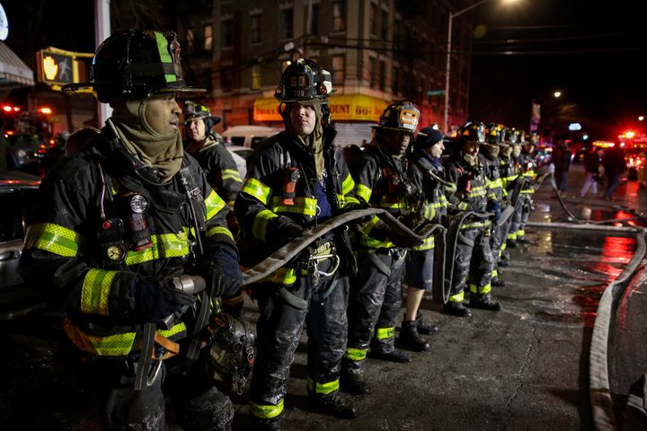 Fire Department of New York personnel at the scene of the fire.