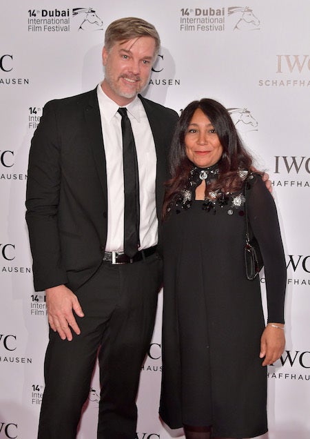 Brad Niemann and Haifaa al Mansour pose on the red carpet for the IWC Filmmaker Award