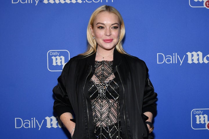 Lindsay Lohan attends the DailyMail.com holiday party with Flo Rida on Dec. 6, 2017.