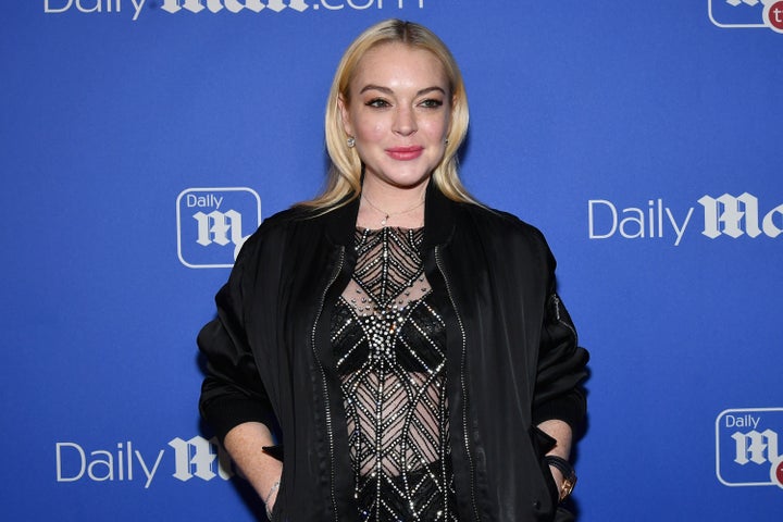 Lindsay Lohan attends the DailyMail.com holiday party with Flo Rida on Dec. 6, 2017. 